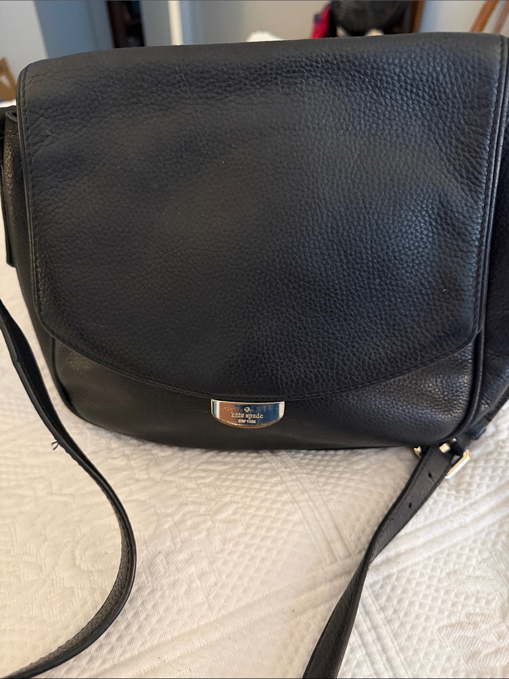 Kate Spade  black leather flap crossbody with gold-tone plaque